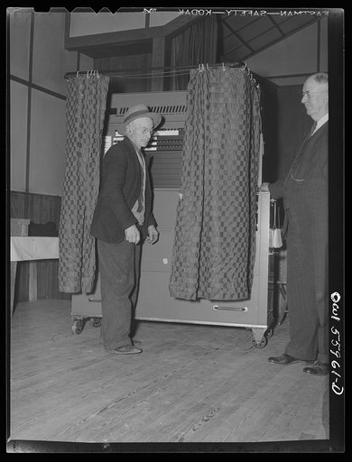 Barnesville, Maryland. A citizen leaving the voting booth at the community hall where he has just cast his vote in the general election