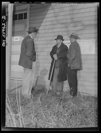 Barnesville, Maryland. A group of older citizens discussing the general election outside the community hall where they have just worked