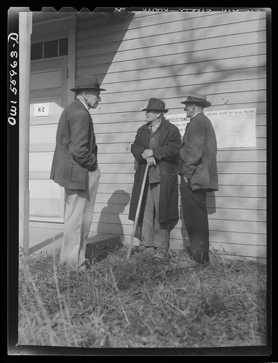Barnesville, Maryland. A group of older citizens discussing the general election outside the community hall where they have just voted