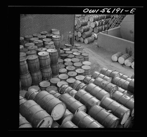 Philadephia, Pennsylvania. Pile of oil drums near Grays Ferry Road