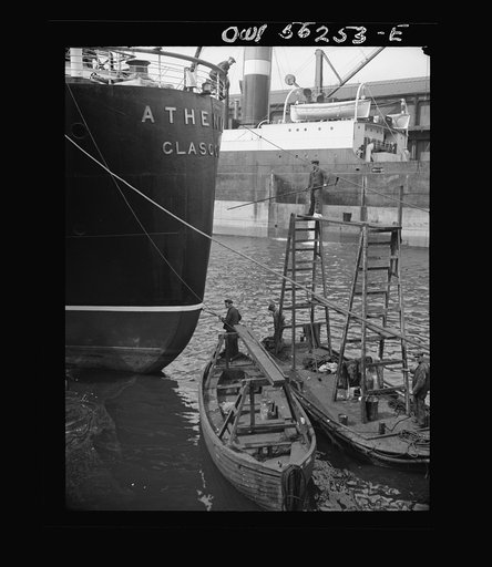 Glasgow, Scotland. Painting the stern of the S.S. Athenia. This liner was the first ship sunk in the Second World War