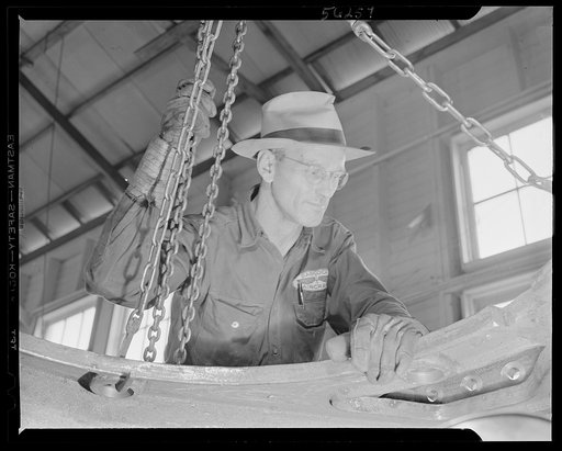 Untitled photo, possibly related to: De Land pool. Skilled craftsmen. Forty-year-old John Oliver formerly operated a fishing camp on Florida's east coast. When the De Land pool formed, Oliver volunteered and turned out to be a first class machinist who had learned his trade in Oklahoma. Now he is as