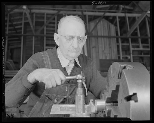 Untitled photo, possibly related to: De Land pool. Carr's Machine Shop. Nothing makes W.E. Mansfield so mad as the idea that Florida shops cannot do fine precision work. He should know, for he's doing it in a member shop of the De Land pool. He worked on weapons and ammunition for the Winchester Arm