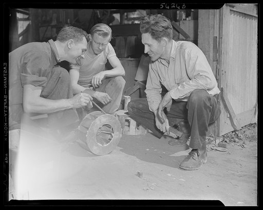 Untitled photo, possibly related to: DeLand pool. Improvised foundry, Daytona Beach. City fireman J.L. Clayton of Daytona Beach, Florida, turned curiosity into war production. Several years ago he became interested in molding metals, particularly brass and aluminum in his spare time and put up a one