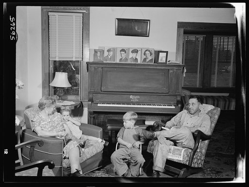 Untitled photo, possibly related to: De Land pool. La Roe shop. The La Roe family of Eustis, Florida, after a day's work for the De Land pool. Left is Mrs. La Roe with her two-year-old granddaughter, next is four-year-old Eugene, Clarence La Roe's son, and Mr. La Roe