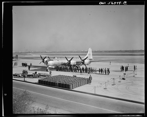 B-29 Super Fortress on display at Washington National Airport. Note fuel tanks in foreground which is necessary to fill fuel tanks--equivalent to railroad tank car