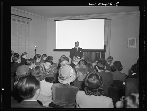 Washington, D.C. Arthur H. DeBre, director of research of the Motion Picture Producers and Distributors of America, giving a welcome address and short talk on the showing of the film "A lady talks back," at the United Nations Club