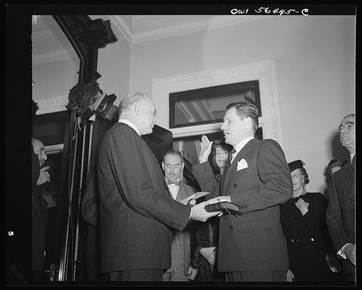 Justice Reed administering oath of office to Nelson A. Rockefeller, Assistant Secretary (American Republic Affairs), U.S. State Department