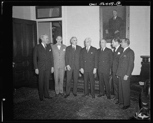 Secretary of State Edward Stettinius presenting new Under-Secretary of State Joseph C. Grew and five of the new assistant secretaries at the oath of office ceremonies. Left to right: William L. Clayton; Dean Acheson; Joseph C. Grew, Under-Secretary; Edward R. Stettinius, Secretary of State; Archibal