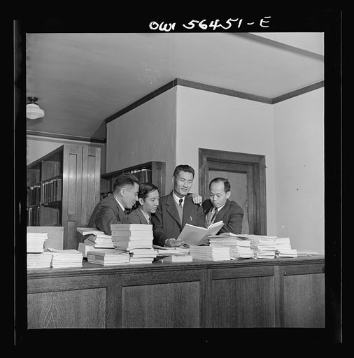 Chinese technical experts (social welfare) in University of Maryland library where they are taking training course given by UNRRA (United Nations Relief and Rehabilitation Administration). From left: Pei-chien Sun, Chi Kuo, Rao-ku Cheng, and Chung-chang Yang