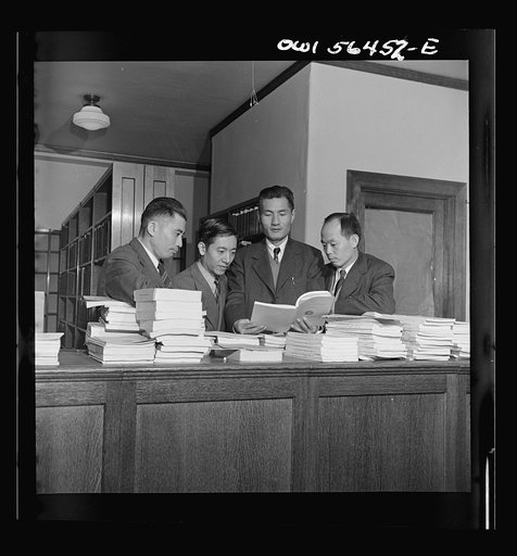 Chinese technical experts (social welfare) in University of Maryland library where they are taking training course given by UNRRA (United Nations Relief and Rehabilitation Administration). From left: Pei-chien Sun, Chi Kuo, Rao-ku Cheng, and Chung-chang