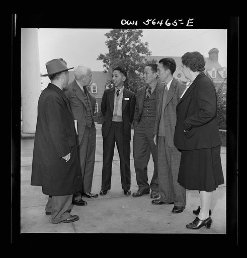 Chinese technical experts who are attending UNRRA (United Nations Relief and Rehabilitation Administration) training center at the University of Maryland discuss the program with Mr. F.L. McDougall, economic advisor for the High Commission for Australia and the Australian government delegate to the 