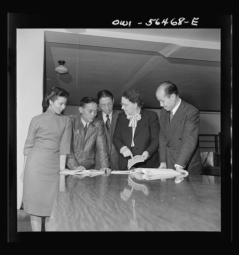 Chinese technical experts inspect reference material in University of Maryland library where they were taking courses offered by the UNRRA (United Nations Relief and Rehabilitation Administration) training center. From left: Miss Ing (from Far Eastern Division, UNRRA Washington  office); H.W. Li; .P