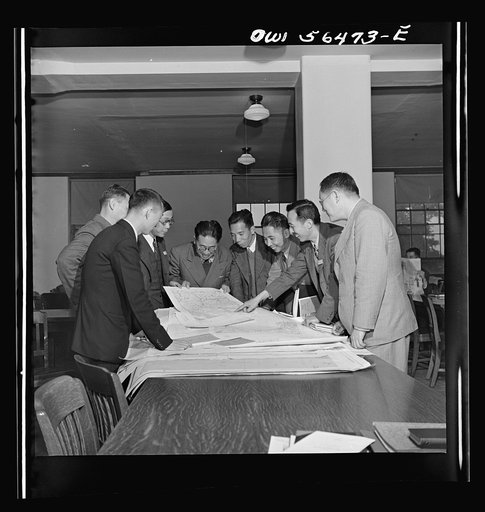 Chinese water conservancy experts examining contour maps at the University of Maryland, where they are taking courses at the UNRRA (United Nations Relief and Rehabilitation Administration) training center