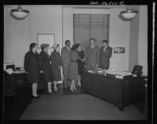 Untitled negative showing (left to right) Grace E. Blackett (United Auto Workers Union, Anne Murkovich (American Federation of Hosiery Workers), Julia O'Connor Parker (International Brotherhood of Electrical Workers) and Maida Stewart Springer (International Ladies' Garment Workers Union) shaking ha