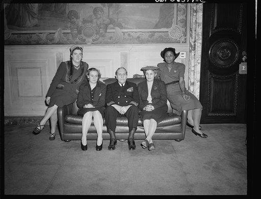Untitled negative showing (left to right) Julia O'Connor Parker (International Brotherhood of Electrical Workers), Grace E. Blackett (United Auto Workers Union), Admiral Clark H. Woodward, Anne Murkovich (American Federation of Hosiery Workers), and Maida Stewart Springer (International Ladies' Garm