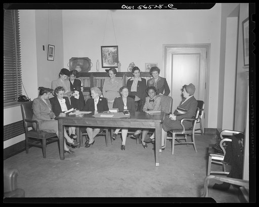 Untitled negative showing (left to right at left end of table): Anne Murkovich (American Federation of Hosiery Workers) and Grace E. Blackett (United Auto Workers Union) and (left to right at right end of table): Maida Stewart Springer (International Ladies' Garment Workers Union) and Julia O'Connor