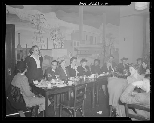 Untitled negative showing: Grace E. Blackett (United Auto Workers Union), standing and speaking; Julia O'Connor Parker (International Brotherhood of Electrical Workers) (4th from left); Maida Stewart Springer (International Ladies' Garment Workers Union) (7th from left) and Anne Murkovich (American 
