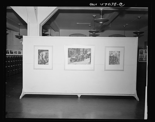 Installation of the United States Office of War Information (OWI) exhibit of original drawings and paintings by artists now in the armed forces. Preview, before shipping to Australia, held at the office of the Overseas Picture Division in the Auditor's Building