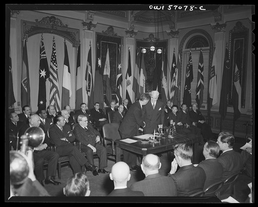 Ambassador Henri Bonnet and Secretary of State Stettinius shake hands upon the occasion of the signing of the United Nations declaration by France