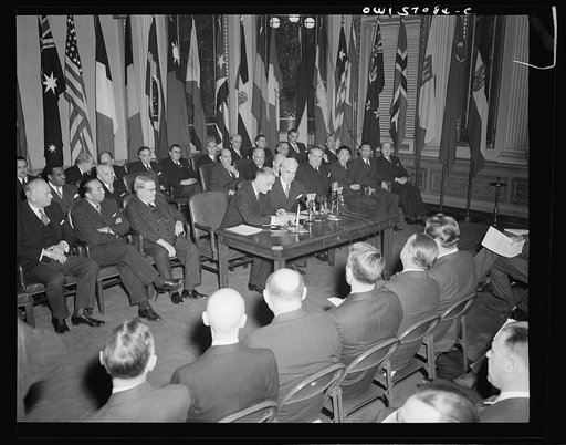 Washington, D.C. Henri Bonnet, French Ambassador, signing the United Nations declaration at the State Department
