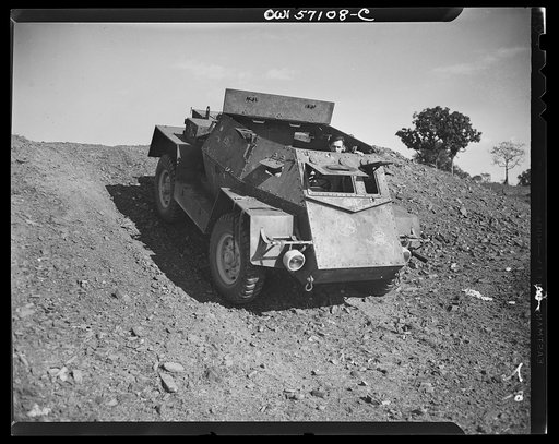 United States "lend-lease" program in eastern India. A newly completed combat car on the testing ground "somewhere in India." The armor plate is put on the chassis in India. Lend-lease materials and equipment play a vital part in the manufacture of these cars