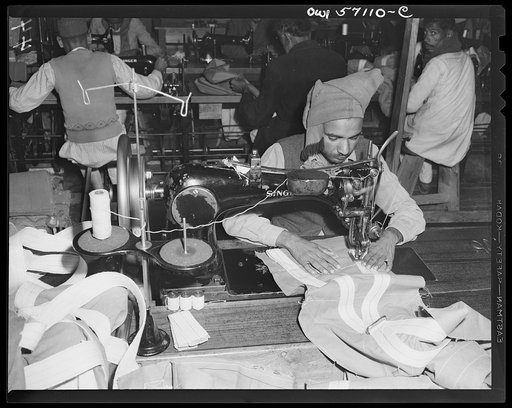 United States "Lend-lease" program in eastern India. American-made sewing machines, supplied under lend-lease, enable Indian workmen to turn out parachutes for their own army