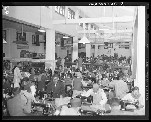 United States "lend-lease" program in eastern India. Indian workmen turn out parachutes for their own Army. Lend-lease sewing machines have enabled this factory to expand its production enormously