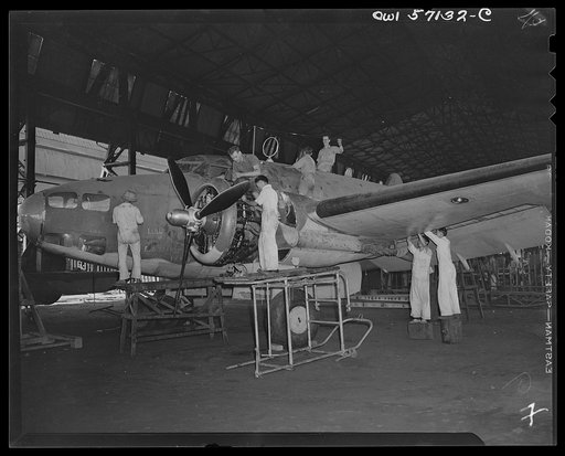 United States "lend-lease" program in eastern India. A mixed crew of English, Chinese and Indian workmen repair a lend-lease Hudson bomber which was shot up and damaged too badly for field repairs during a bombing raid on the Japanese occupied portion of Akyab, an island off the coast of Burma. The 