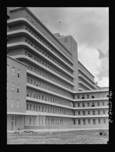 Melbourne, Australia. United States Army hospital. Exterior view of hospital. Towering high above the city is Australia's newest and finest medical structure, built as a civic enterprise as the Royal Melbourne Hospital. Today, renamed the United States Army Fourth General Hospital, it is a healing p