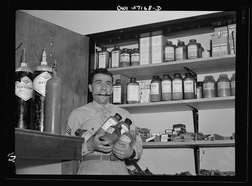 Melbourne, Australia. United States Army hospital. Sergeant Alfred Baron, Newark, New Jersey, in  medical store room