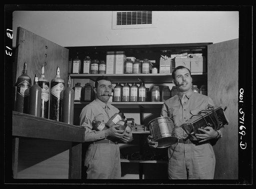 Melbourne, Australia. United States Army hospital. Sergeant Alfred Baron, Newark, New Jersey (left) and Technical Sergeant Richard Perry,  Mansfield Ohio, in medical store room