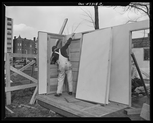 Houses for Britain. Assembling pre-fabricated temporary emergency house of the type which it is planned to ship to Great Britian under lend-lease to alleviate an acute housing shortage in Britian due to bombings. This model house was erected at Scott Circle, Washington, D.C. by the Federal Public Ho