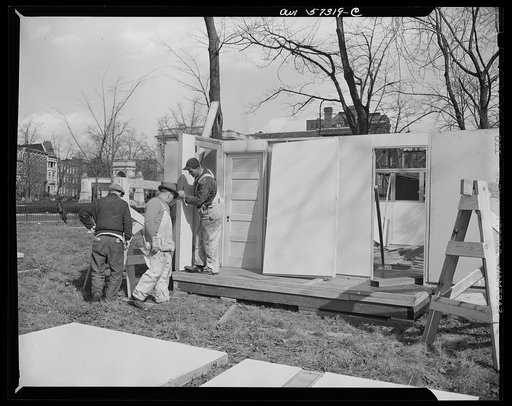 Houses for Britain. Partially assembled pre-fablicated temporary emergency house of the type which it is planned to ship to Great Britain under lend-lease, and which was erected by FPHA at Scott Circle, Washington, D.C. Materials have been allotted to FEA by  War Production Board for 30,000 of these