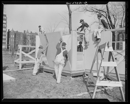 Houses for Britain. Partially assembled pre-fabricated temporary emergency house of the type which it is planned to ship to Great Britain under lend-lease, erected at Scott Circle, Washington, D.C.