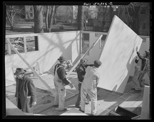 Houses for Britain. Partition panel going into place in model house erected at Scott Circle, Washington, D.C. by the the Federal Public Housing Authority. It is planned to ship this type of prefabricated, temporary emergency dwelling to Great Britain under lend-lease. Materials have been allotted by
