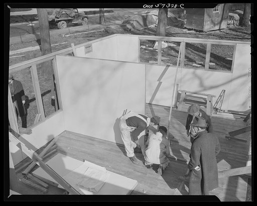 Houses for Britain. Partition panel going into place in model house erected at Scott Circle, Washington, D.C. by the the Federal Public Housing Authority. It is planned to ship this type of prefabricated, temporary emergency dwelling to Great Britain under lend-lease. Materials have been allotted by