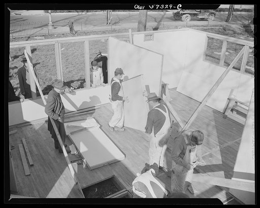 Houses for Britain. Partition panels going into place in model house erected by the Federal Public Housing Authority at Scott Circle, Washington, D.C. It is planned to ship 30,000 of this type of prefabricated, temporary emergency dwelling to Great Britain under lend-lease to alleviate acute housing