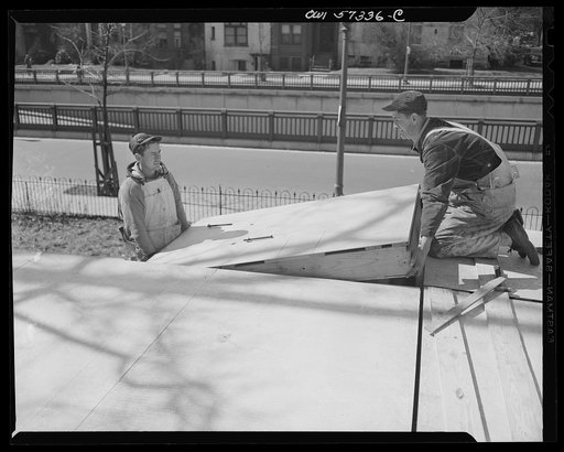 Houses for Britain. Installing one of the roof panels in the prefabricated temporary emergency house of the type which the United States will ship to Great Britain under lend-lease. 30,000 will be shipped to Great Britain to alleviate acute housing shortage there due to bombings. Model house erected