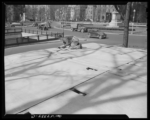 Houses for Britain. Putting finishings touches on roof of model house erected at Scott Circle, Washington, D.C. by Federal Public Housing Authority. This type of pre-fabricated temporary emergency house will be shipped to Great Britain by the United States under lend-lease. War Production Board has 