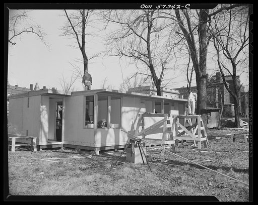 Houses for Britain. Partially assembled prefabricated temporary emergency house of the type which the United States will ship to Great Britain under lend-lease. This sample was erected by the Federal Public Housing Authority at Scott Circle, Washington, D.C.