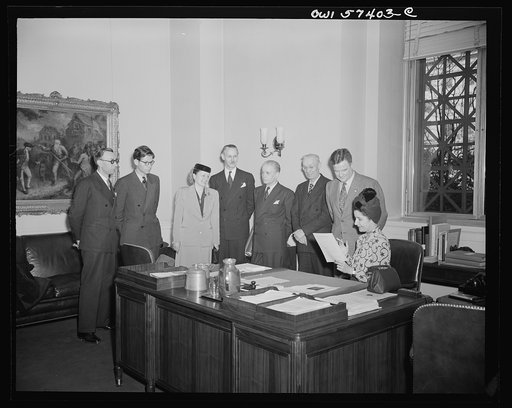 French journalists visit the National Gallery of Art, Washington, D.C. March 4, 1945. Shown in Mr. MacGill James' office. Mr. James is assistant director of the Gallery. Left to right: Pierre Denoyer, Fobert Villers, Mme. Rene Batigne, M. Rene Batigne, Francois Prieur, Louis Lombard, Mr. James, and 