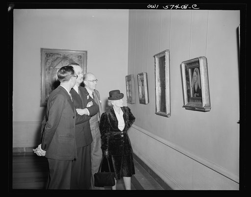 French journalists visit the National Gallery of Art, Washington, D.C., March 4, 1945. Left to right: Pierre Denoyer; Rene Batigne, Curator of the French Section at the Gallery who guided the guests on their tour; M. Jacques Rabut, Head of the French Construction Mission in Washington; and Mme. Andr