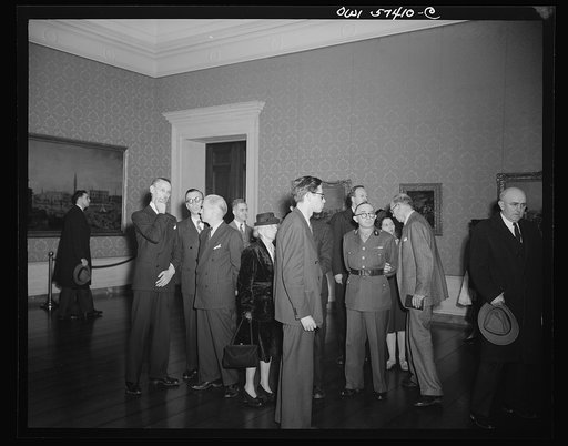 French journalists visit the National Gallery of Art, Washington, D.C., March 4, 1945, where they are  shown around by Rene Batigne, Curator of the French Section of the Gallery. Left to right: M. Batigne, Pierre Denoyer, Francois Prieur, Frederick Paul Farish of the OWI French Desk, Mme. Andree Vio