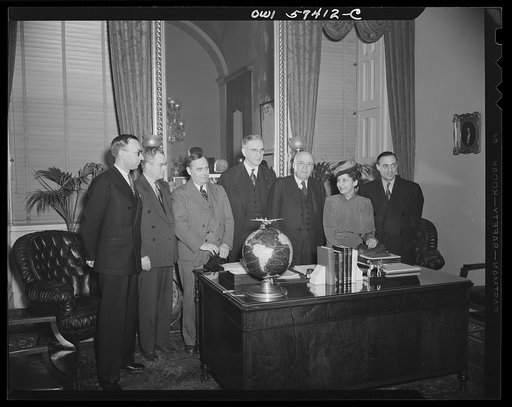 French journalists visiting the United States call on Speaker Rayburn at his office in the Capitol. Left to right: Pierre Denoyer, Congressman Ramspeck, Congressman Joe Martin, Congressman McCormick, Speaker Sam Rayburn, Mme. Etiennette Benichon and Stephane Pizella.