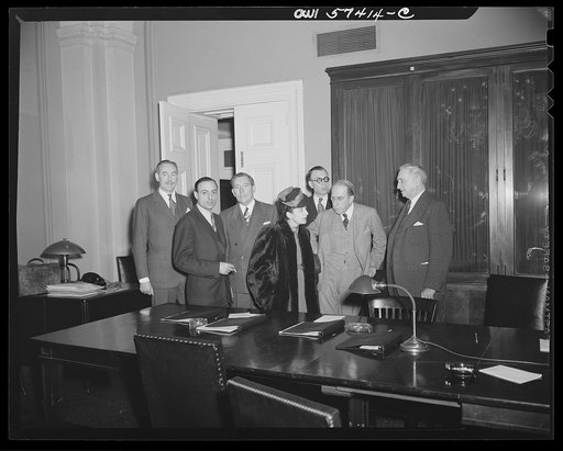 French journalists visiting the United States call on Senator George, Acting Chairman of the Foreign Relations Committee in the United States Senate. Individuals pictured include: Stephane Pizella, Mme. Etiennette Benichon, Pierre Denoyer, Senator Theodore Green, and Senator George