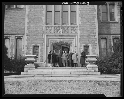 French journalists visiting the United States are guests of French Ambassador to the United States, Henri Bonnet at a luncheon at the French Embassy on March 6, 1945. Standing on the front steps of the Embassy as they are leaving are, left to right: Mme. Etiennette Benichon, Mme. Andree Viollis, Rob