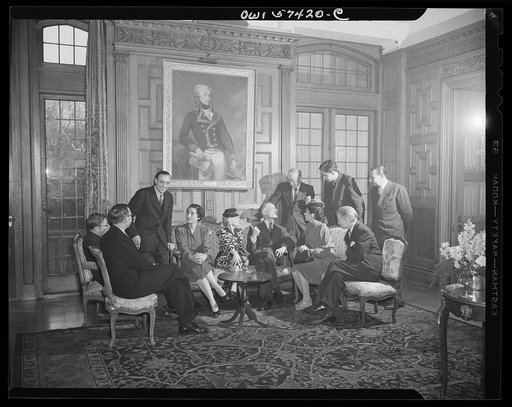 French journalists visiting the United States are guests of French Ambassador to the United States, Henri Bonnet at a luncheon at the French Embassy on March 6, 1945. They are standing on the front steps of the Embassy as they are leaving.