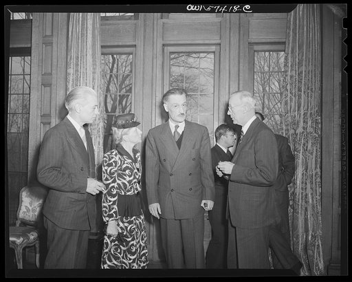French journalists visiting the United States call on French Ambassador to the United States Henri Bonnet at the French Embassy where a luncheon was given for them March 6, 1945. Left to right: Francois Prieur, Mme Andree Viollis, Ambassador Bonnet and M. Louis Lombard