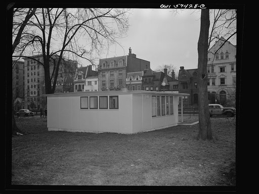 Houses for Britain.  Rear, side view of model prefabricated house erected by the Federal Public Housing Authority at Scott Circle, Washington, D.C. of the type of temporary, emergency family dwellings which it is planned to ship to Great Britain under lend-lease. Houses to be twenty-five feet square